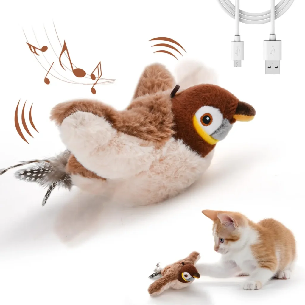 Close-up of the FlappyBird with USB charging cable and a kitten interacting.